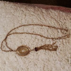 Vintage gold tone necklace with chain medallion